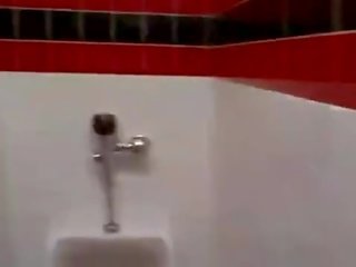 Cashier gives a random stripling a public bathroom blowjob