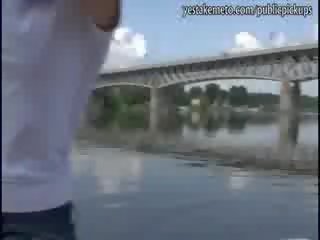 Real amateur brunette has sex film in public in a boat and eats the cum