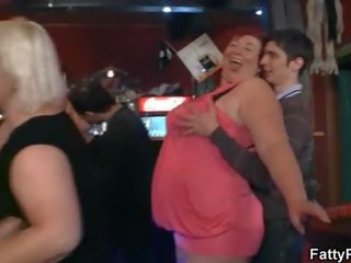 Crazy plump chicks have fun in the bar