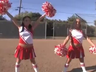 Cheerleader Girls immediately after Football Game with Quarterback